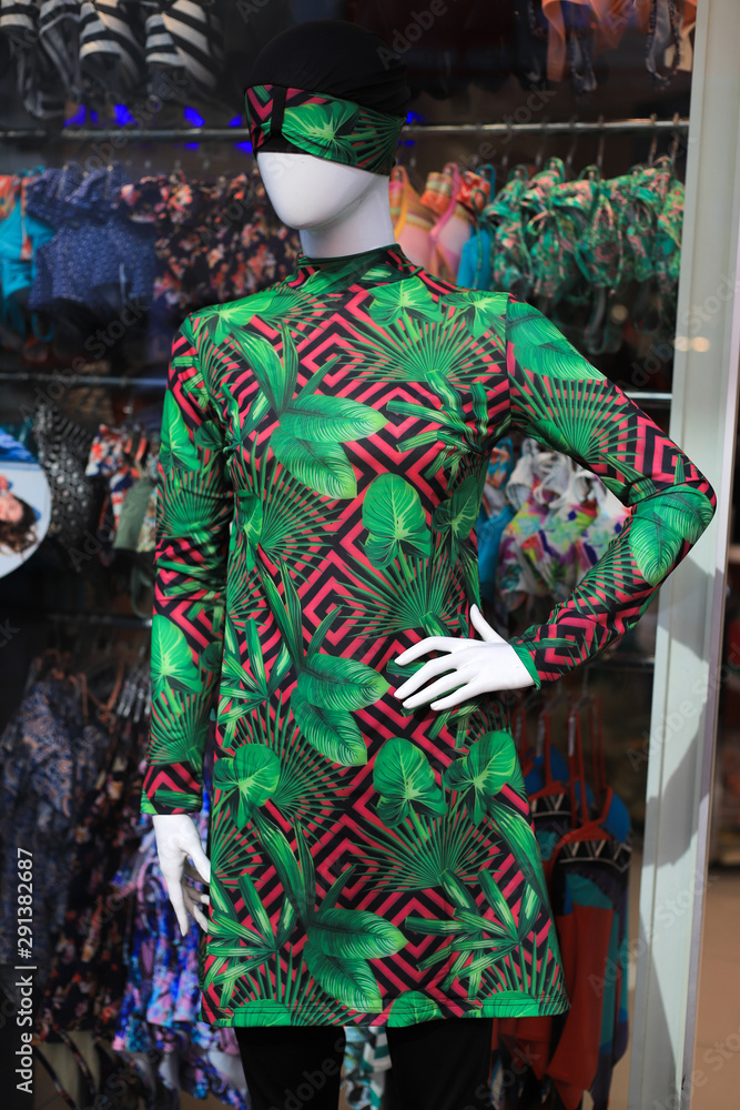 Female mannequin in a green dress
