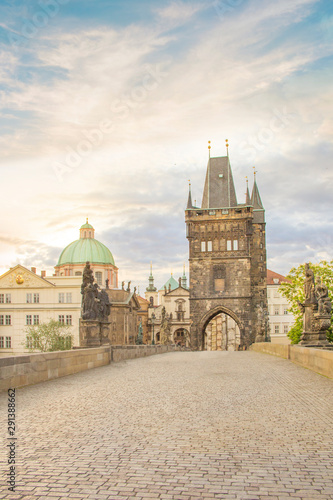 Beautiful view of Old Town Tower of Charles Bridge at dawn in Prague, Czech Republic