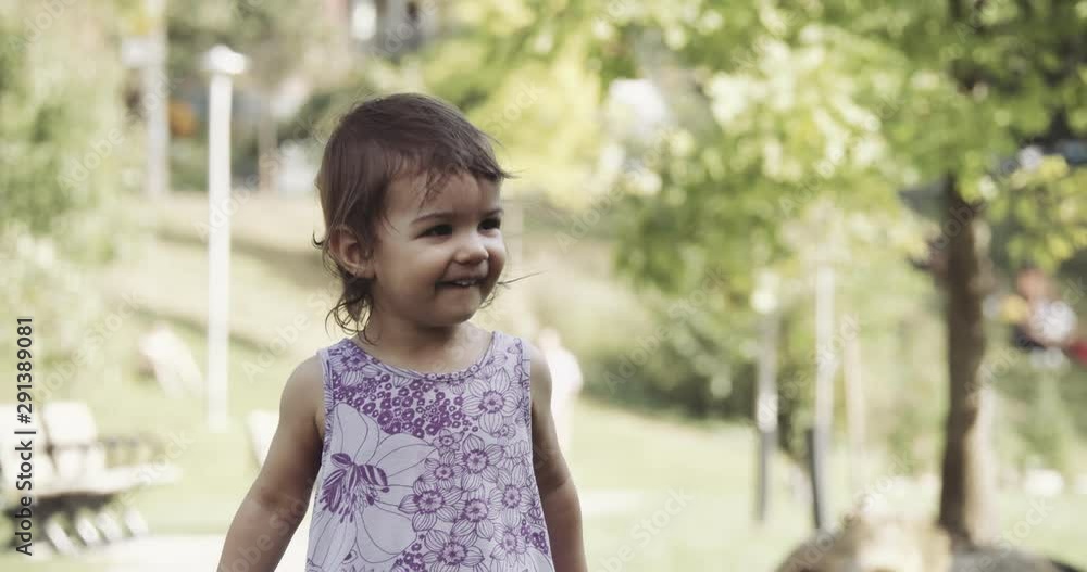 Cute baby girl exploring a park in late summer and jumping for joy. Shot in 4K RAW on a cinema camera. Cute baby girl exploring a park in late summer and jumping for joy. Shot in 4K RAW on a cinema camera.