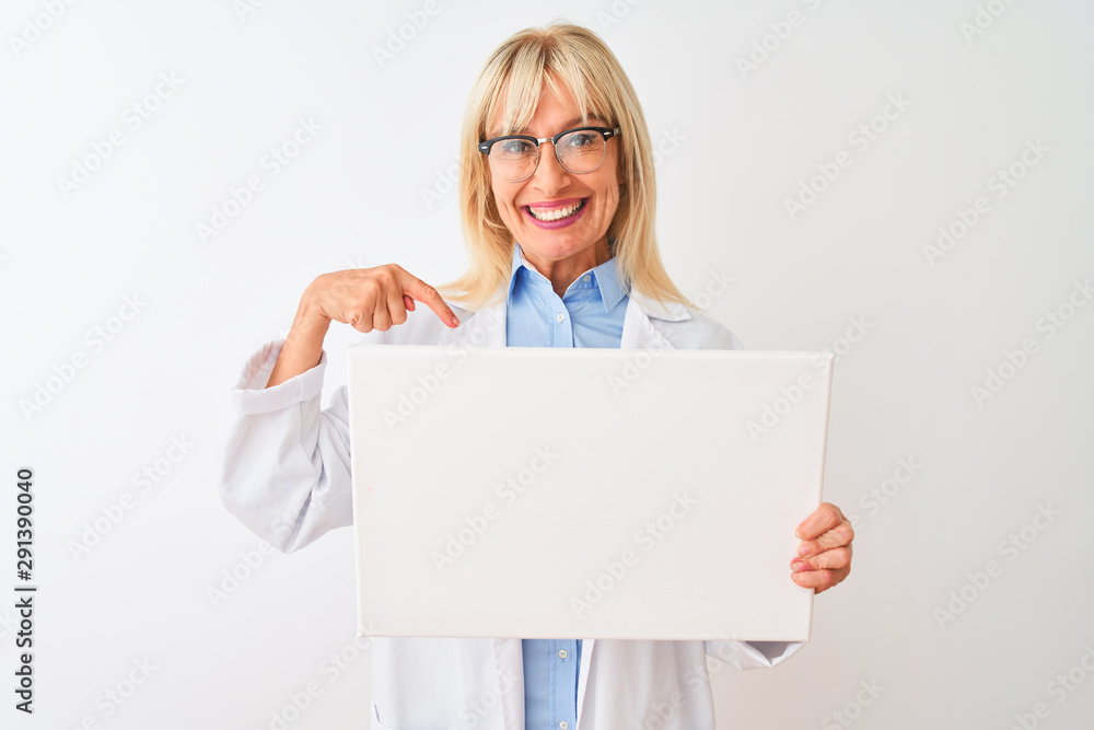 Middle age scientist woman wearing glasses holding banner over isolated white background with surprise face pointing finger to himself Middle age scientist woman wearing glasses holding banner over isolated white background with surprise face pointing finger to himself