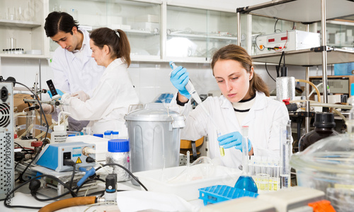 Female student mixing chemicals