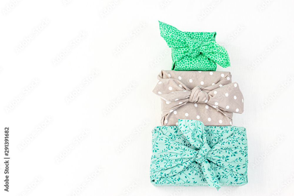 Fabric wrapped gifts, reusable sustainable gift wrapping alternative zero  waste concept with copy space Stock-Foto | Adobe Stock
