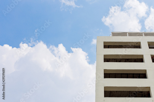  Building on blue sky and cloud background