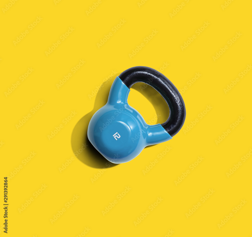 Kettlebell with hard shadow from above - overhead view Kettlebell with hard shadow from above - overhead view