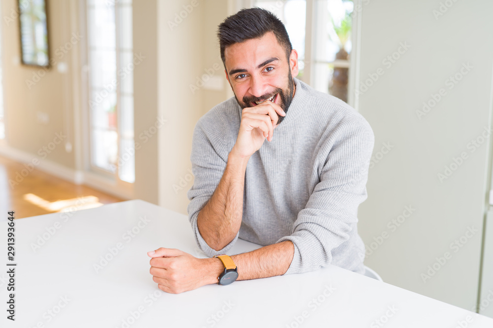 Handsome man smiling cheerful with a big smile on face showing teeth, positive and happy expression Handsome man smiling cheerful with a big smile on face showing teeth, positive and happy expression