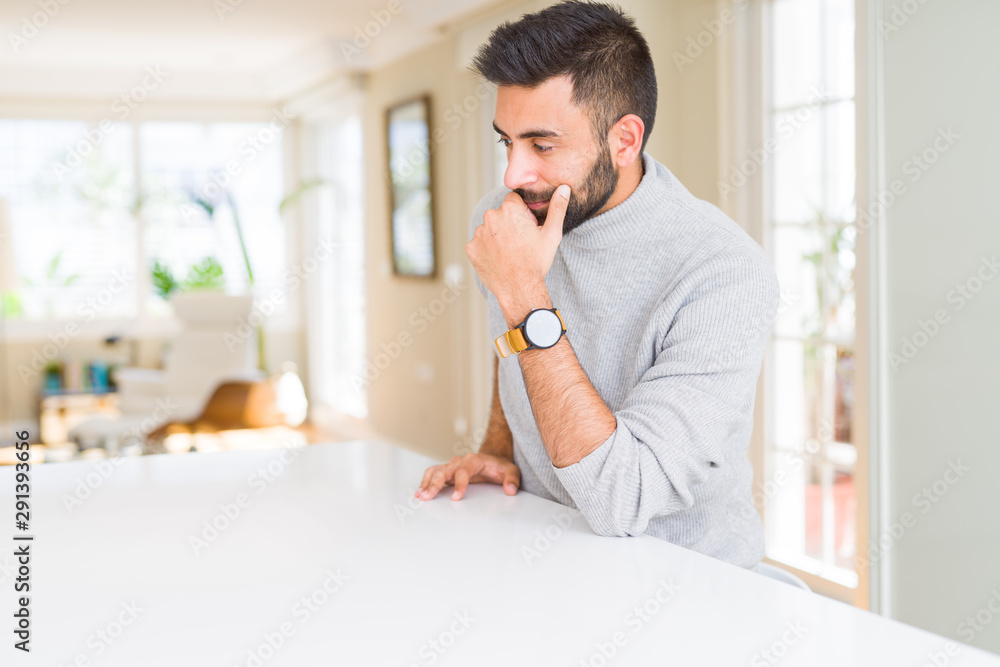 Handsome man looking relaxed and confident Handsome man looking relaxed and confident
