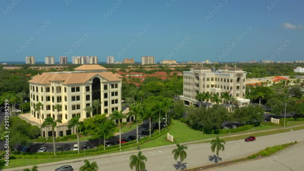 Aerial Naples Florida bank buildings rise to reveal residential coastal neighborhoods Aerial Naples Florida bank buildings rise to reveal residential coastal neighborhoods
