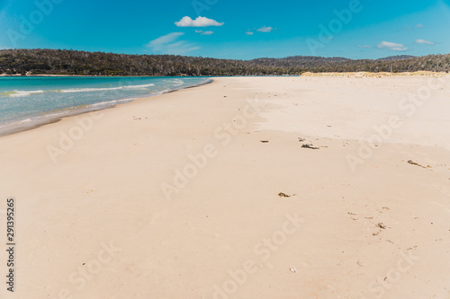 sunny pristine and deserted beach overlooking the South Pacific Ocean
