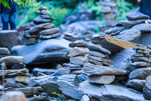 A variety of stones / Inukshuk of Canada beside the creek, Gorge park, Coaticook, Quebec, Canada photo