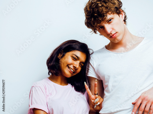 best friends teenage girl and boy together having fun, posing emotional on white background, couple happy smiling, lifestyle people concept, blond and brunette multi nations close up