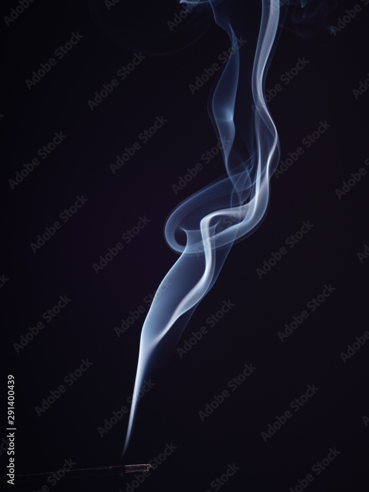 Close up view on steam of white smoke, isolated on black background. Structure of white smoke, brush effect. Aromatic stick for meditation and relaxation, abstract background Close up view on steam of white smoke, isolated on black background. Structure of white smoke, brush effect. Aromatic stick for meditation and relaxation, abstract background