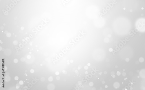 Silver light and white christmas background with blur bokeh beautiful texture. Glow sparkle backdrop. Winter concept. Element for ads, cosmetic advertising design, product, beauty, promotion, montage