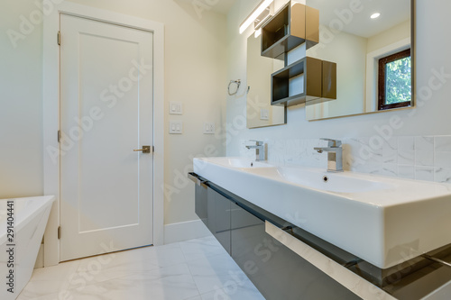 Interior design of a modern bathroom in a newly built house or apartment, hotel room.
