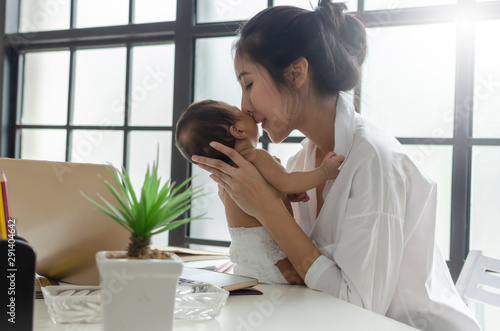Mom enjoy to playing wih her baby on relax time