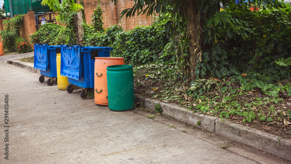 Small and large plastic bins recycle on the street Small and large plastic bins recycle on the street