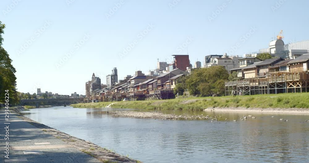 Houses alongside a beautiful river on a hot summer day in Kyoto, Japan soft lighting slow motion 4K Houses alongside a beautiful river on a hot summer day in Kyoto, Japan soft lighting slow motion 4K