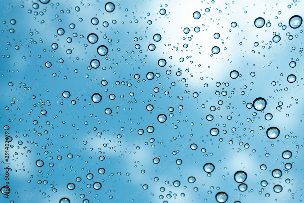 Rain on the window, natural skin of the rain The natural form of rainwater on a sky background. Rain on the window, natural skin of the rain The natural form of rainwater on a sky background.