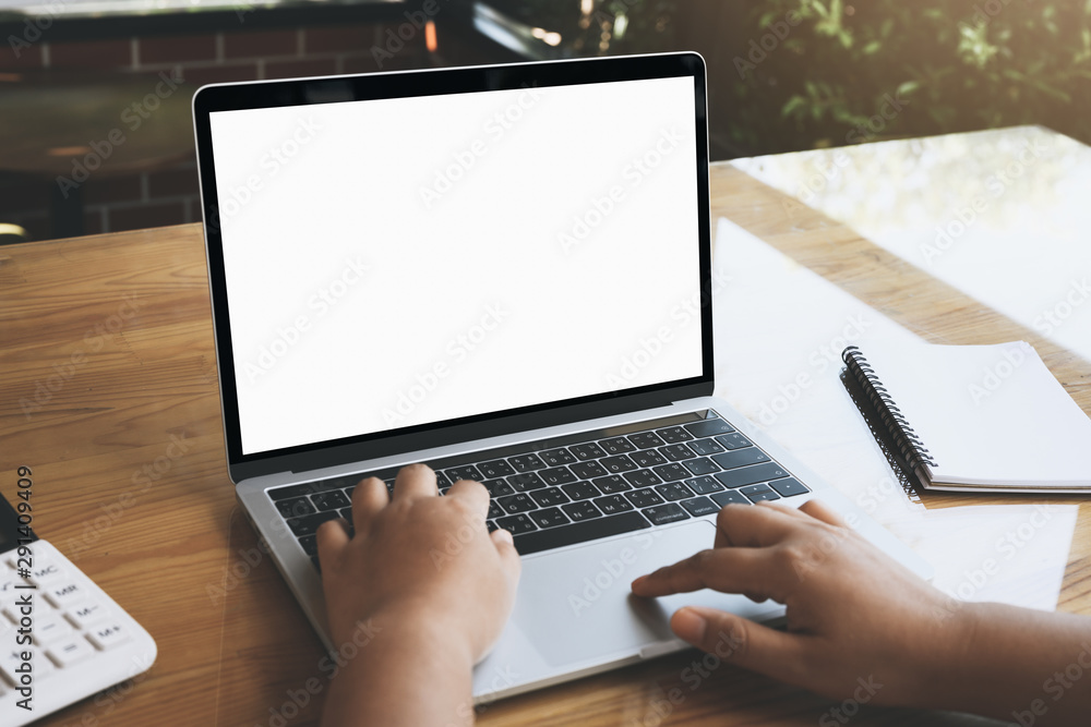 Empty white screen laptop computer on wooden table top, business concept, Notebook mockup design with copy space for text and advertising. Empty white screen laptop computer on wooden table top, business concept, Notebook mockup design with copy space for text and advertising.