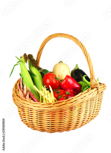 new picked fresh vegetables in basket isolated on white background