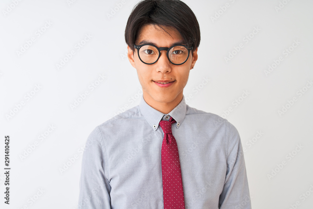Chinese businessman wearing tie and glasses standing over isolated white background with a happy face standing and smiling with a confident smile showing teeth Chinese businessman wearing tie and glasses standing over isolated white background with a happy face standing and smiling with a confident smile showing teeth
