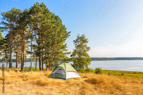 The Camping Tent near the forest lake in Karelia
