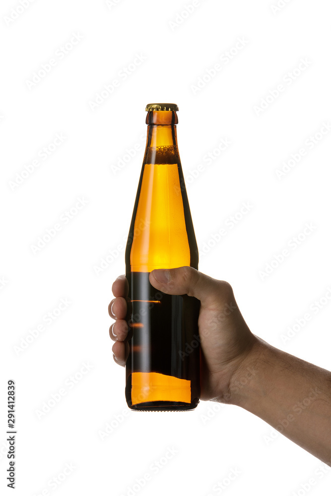 male hand holding brown beer bottle without label isolated on white background male hand holding brown beer bottle without label isolated on white background