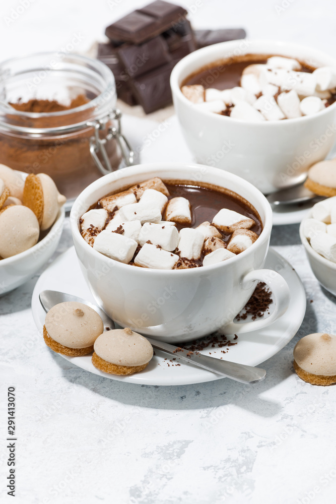 cups of hot chocolate with marshmallows, vertical cups of hot chocolate with marshmallows, vertical