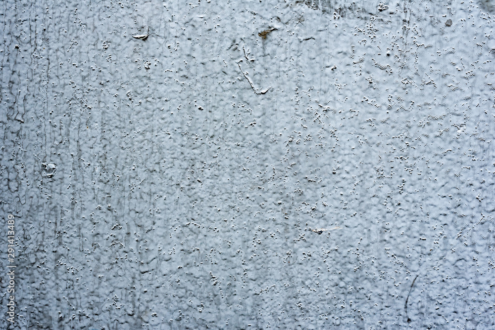 Fototapeta premium Texture of a concrete wall with cracks and scratches which can be used as a background