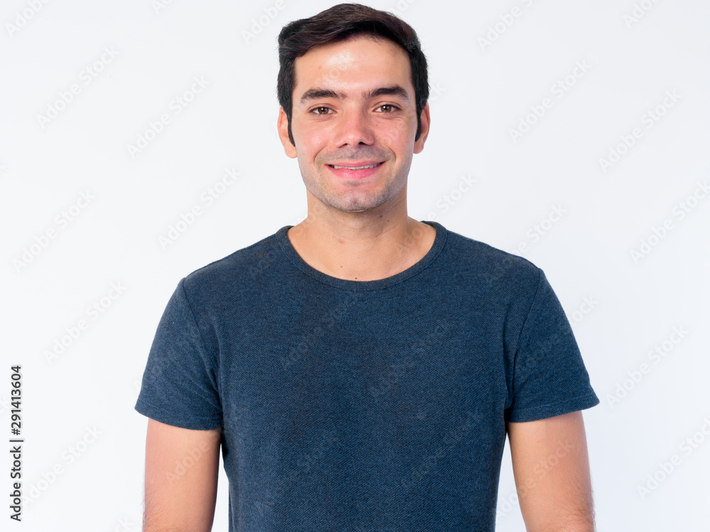 Face of happy young handsome Persian man smiling Face of happy young handsome Persian man smiling
