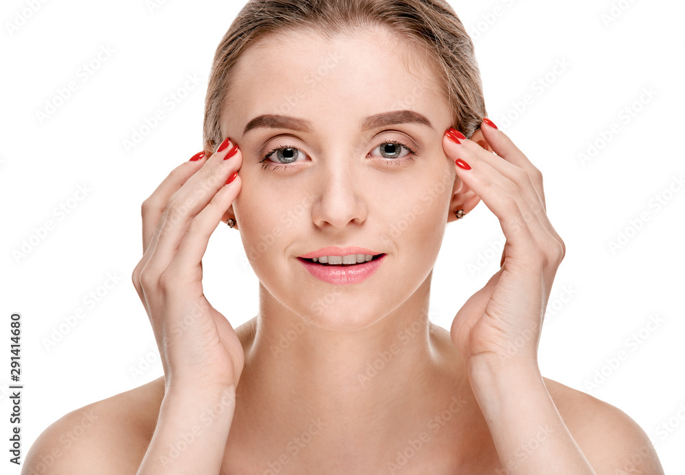 Attractive woman with pure clean skin touching her face Attractive woman with pure clean skin touching her face