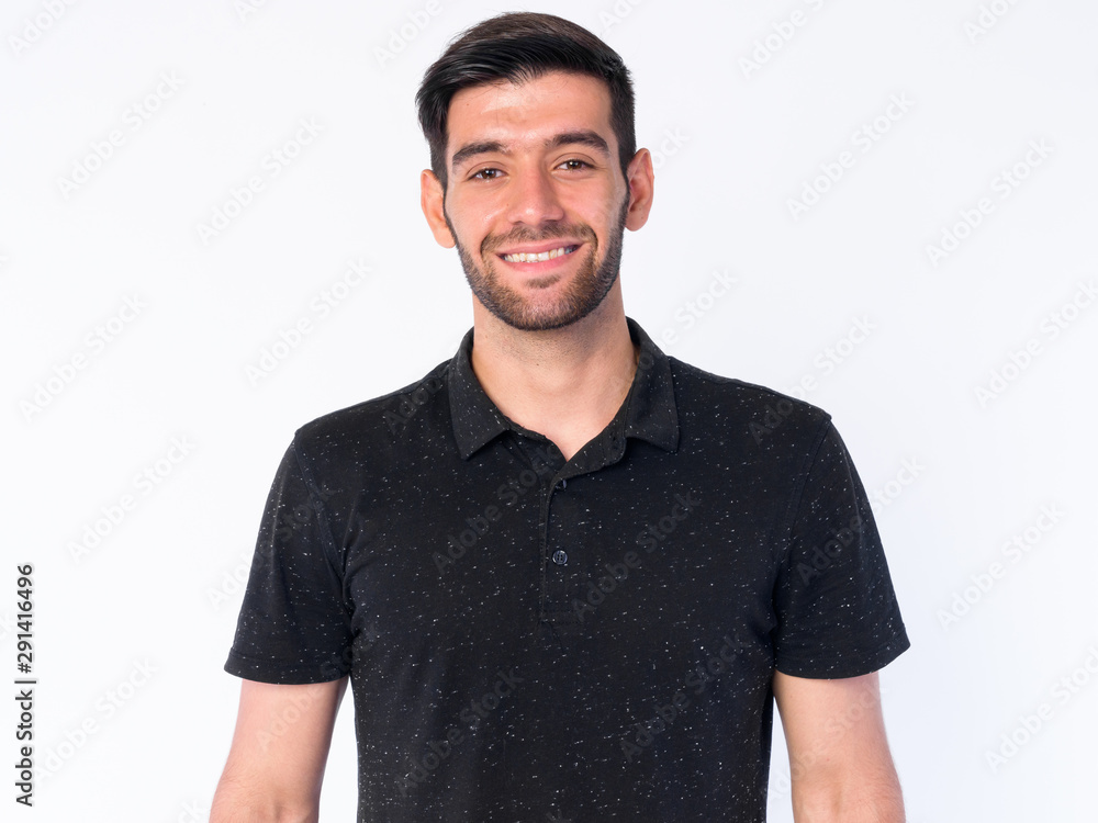 Fototapeta premium Face of happy young bearded Persian man smiling