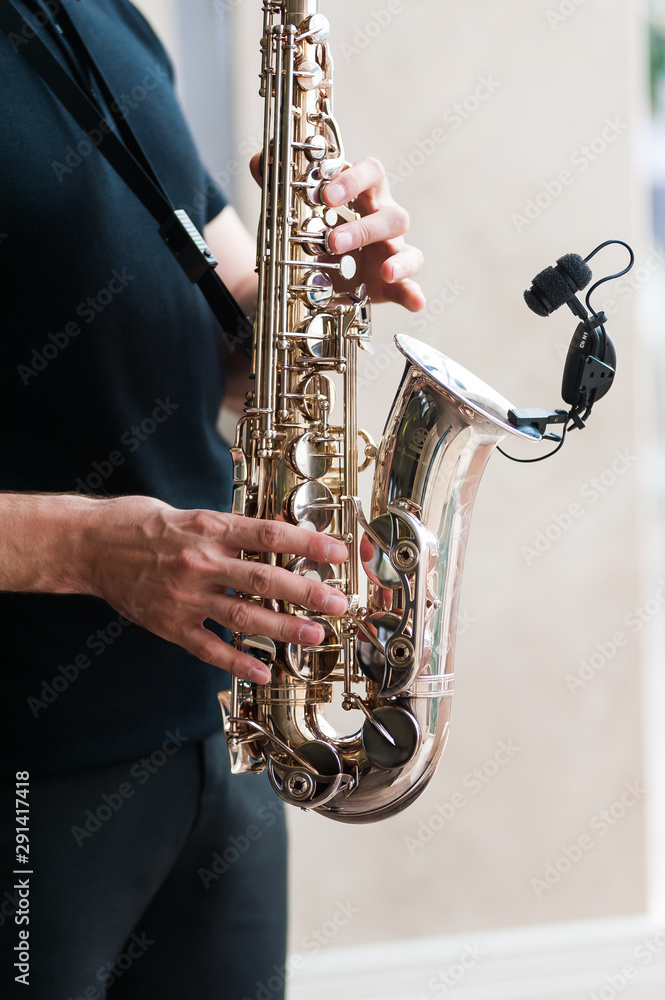 Fototapeta premium A saxophone musician plays a song