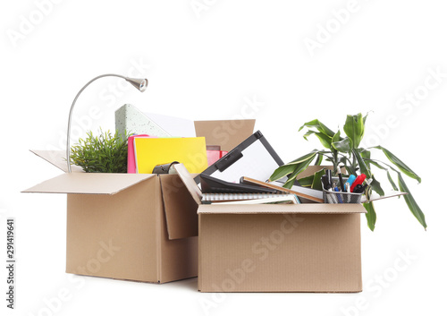 Cardboard boxes full of office stuff on white background photo