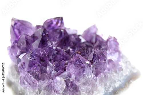Beautiful purple amethyst gemstone on white background, closeup