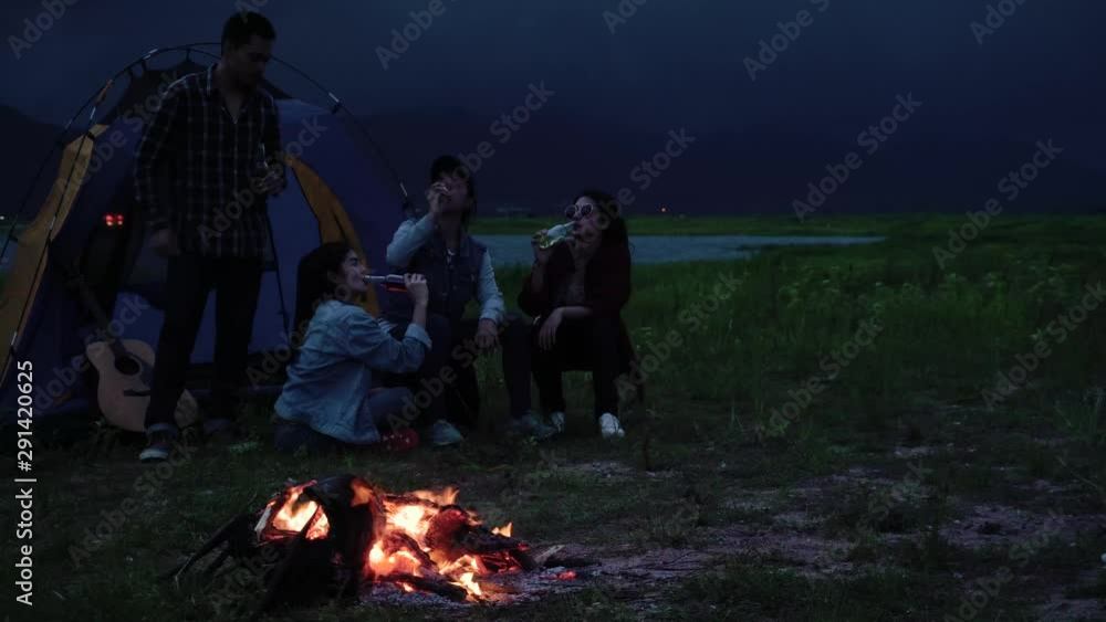 Group of young Asian friends camping or picnic together in forest, teenager female enjoy talking in front of tent. Women do adventure activity and travel on holidays vacation in summer. Slow motion. Group of young Asian friends camping or picnic together in forest, teenager female enjoy talking in front of tent. Women do adventure activity and travel on holidays vacation in summer. Slow motion.