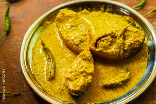 popular Bengali Illish/Hilsa fish curry with grinned mustard seed. photo