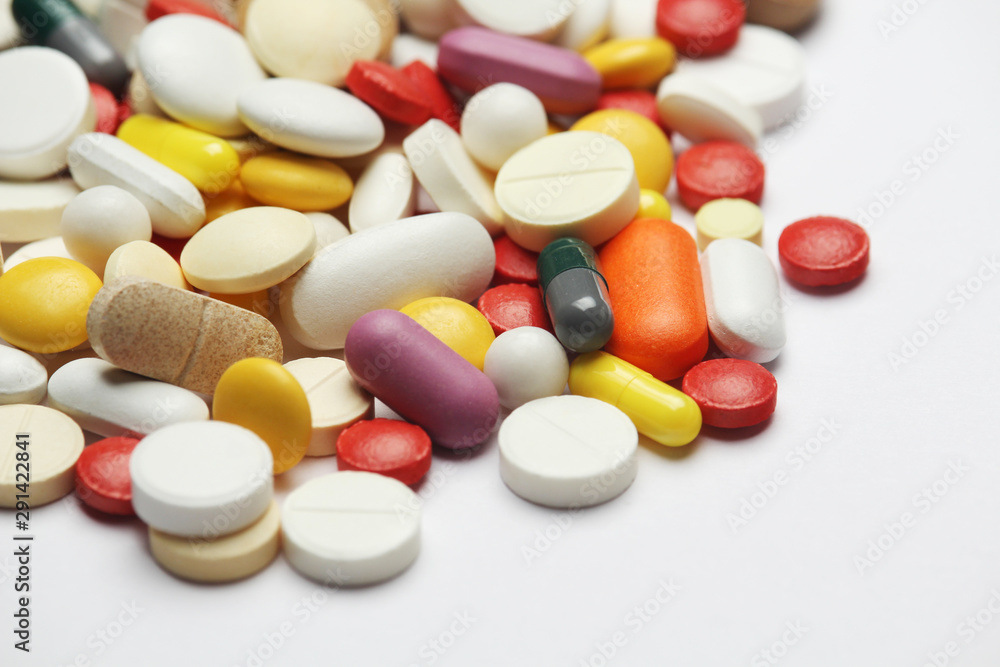 Different colorful tablets at white background Different colorful tablets at white background