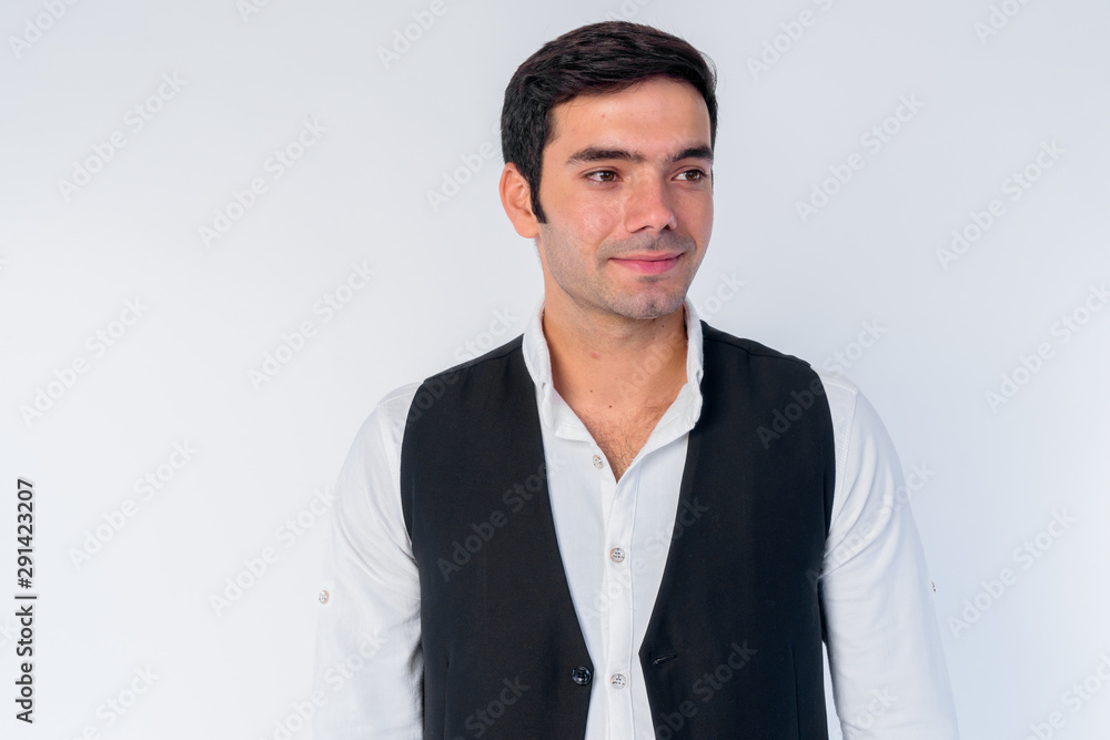 Face of young handsome Persian businessman thinking Face of young handsome Persian businessman thinking