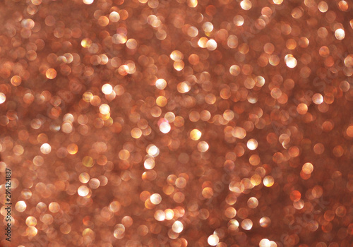 Blurred texture of glitter's paper. Festive background.