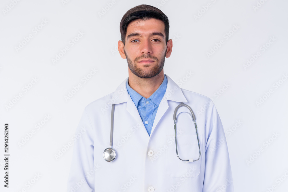 Fototapeta premium Face of young bearded Persian man doctor looking at camera