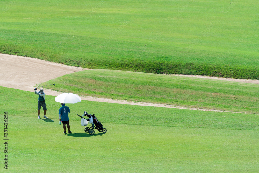 Golfer beats a golf club on the ball. Golfer beats a golf club on the ball.