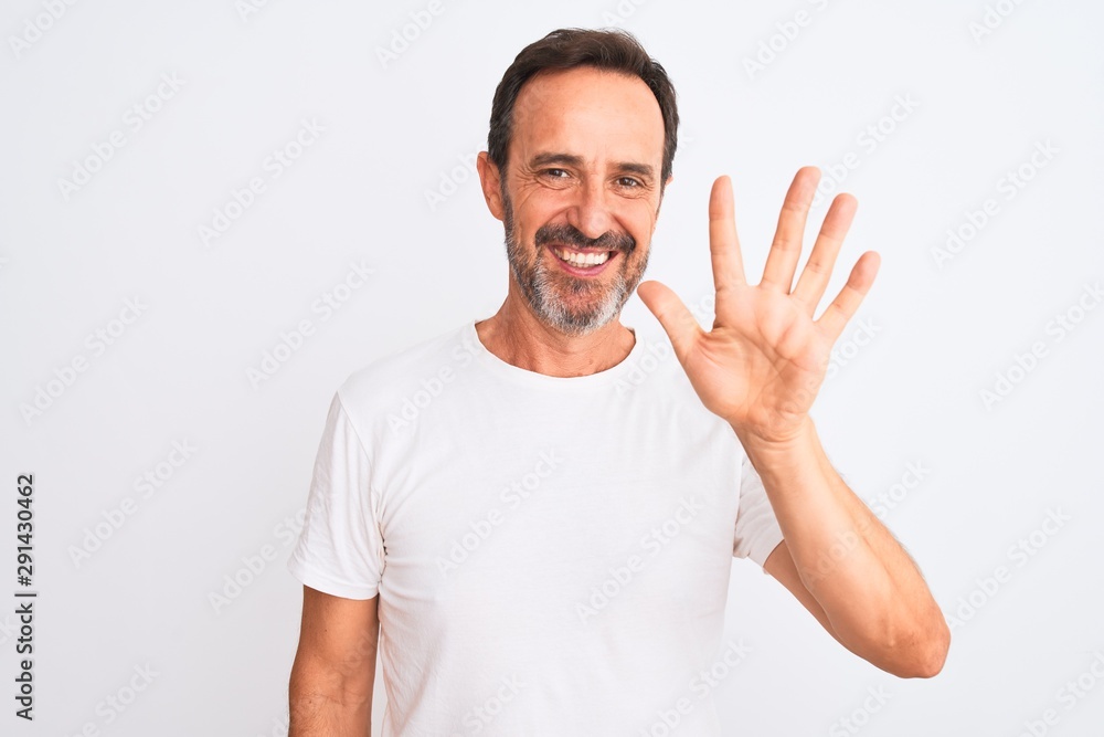 Middle age handsome man wearing casual t-shirt standing over isolated white background showing and pointing up with fingers number five while smiling confident and happy. Middle age handsome man wearing casual t-shirt standing over isolated white background showing and pointing up with fingers number five while smiling confident and happy.