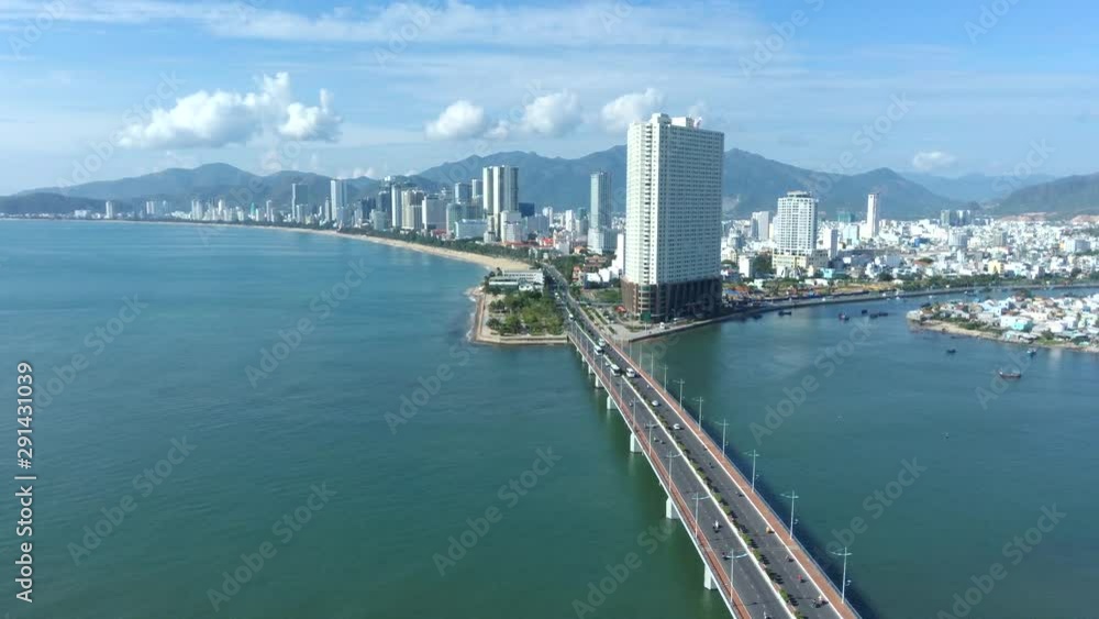 Beautiful aerial drone view of the north area of Nha Trang city and the bay and mountains around. Famous touristic destination of Central Vietnam. Drone is going up in altitude Beautiful aerial drone view of the north area of Nha Trang city and the bay and mountains around. Famous touristic destination of Central Vietnam. Drone is going up in altitude