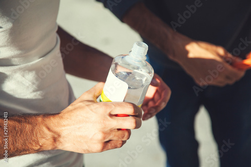 worker hand bottle and cloth