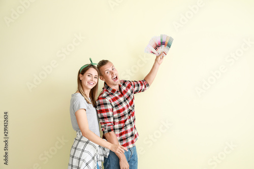 Wallpaper Mural Happy young couple choosing color of walls in their new house Torontodigital.ca