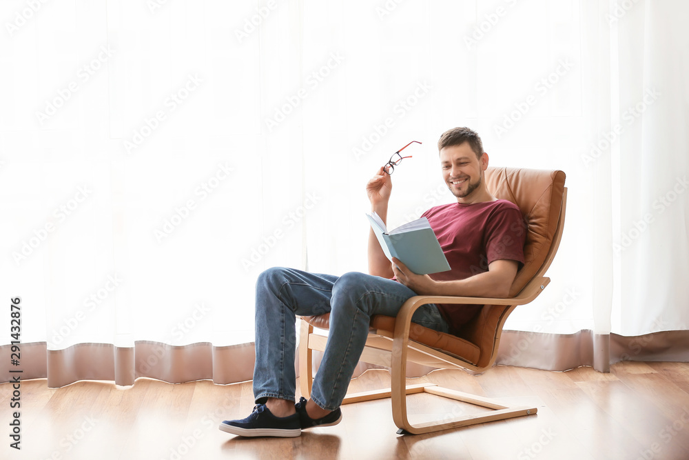 Man with book relaxing at home Man with book relaxing at home