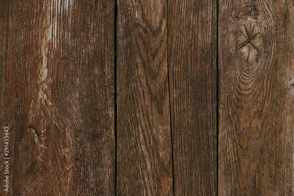 Dark wood timber background. Old wooden planks, texture. Cracked fence. Shabby desk surface. Brown oak boards. Vintage wall, pattern. Weathered hardwood.