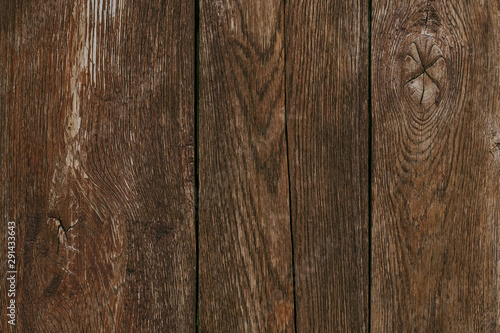 Dark wood timber background. Old wooden planks, texture. Cracked fence. Shabby desk surface. Brown oak boards. Vintage wall, pattern. Weathered hardwood.