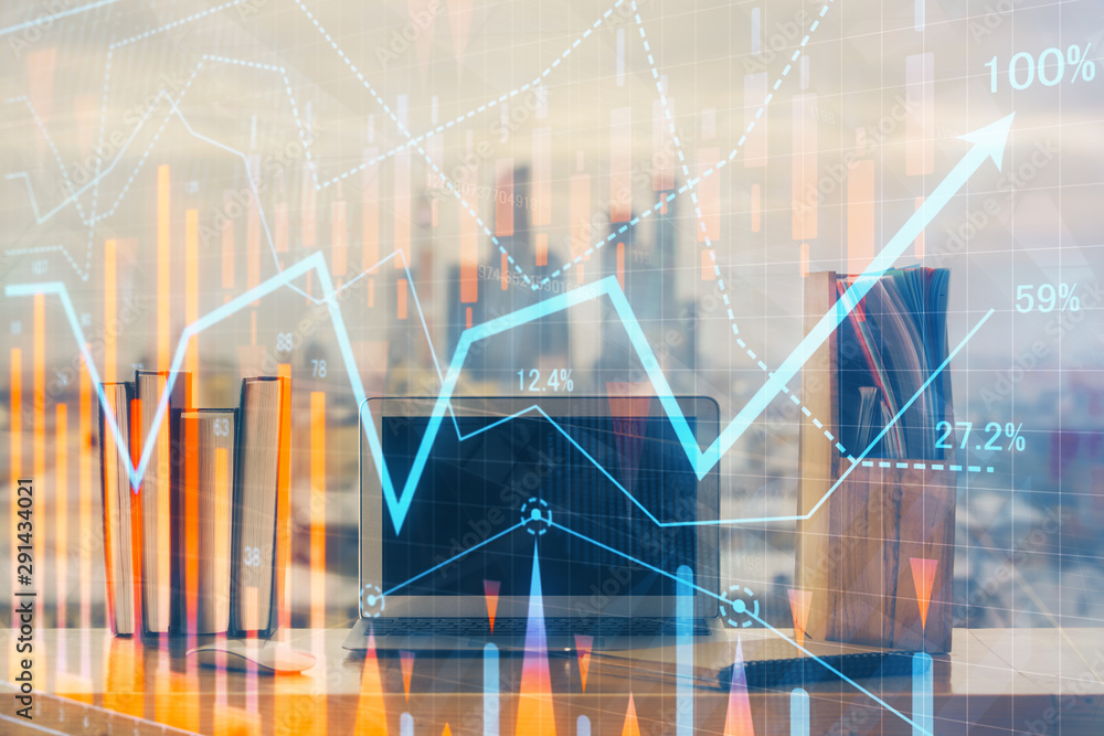 Forex market chart hologram and personal computer background. Double exposure. Concept of investment. Forex market chart hologram and personal computer background. Double exposure. Concept of investment.