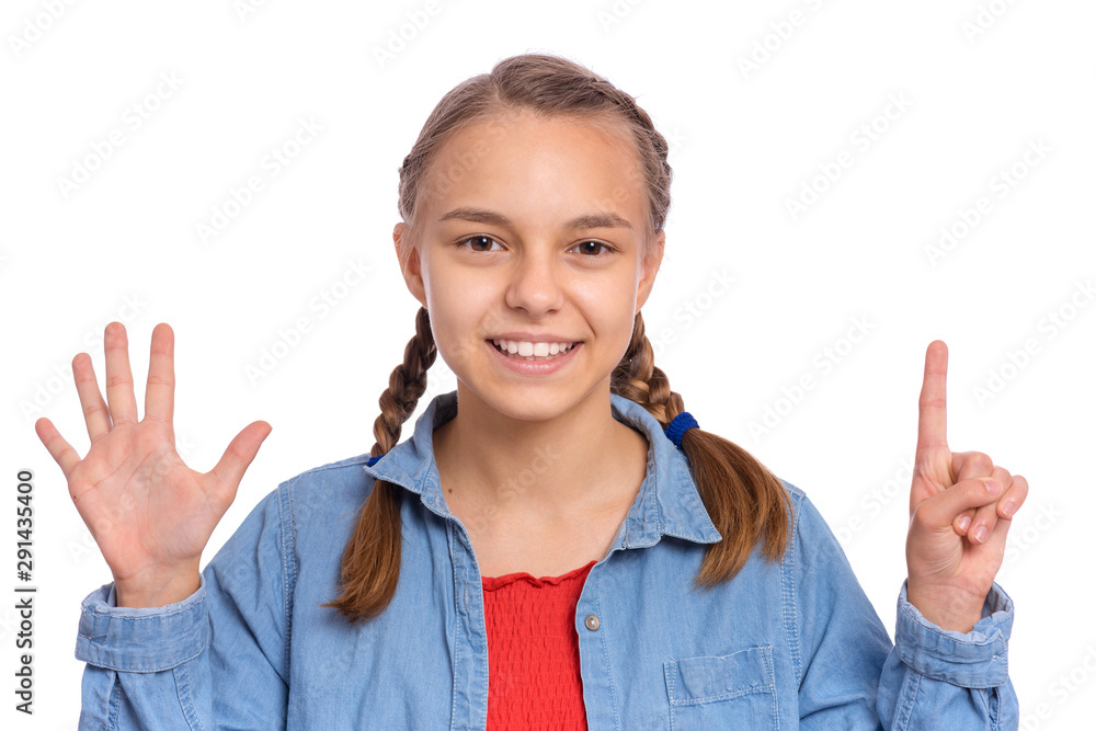 Portrait of happy teen girl showing two palms - 6 fingers, isolated on white background. Happy smiling child doing gesture of number Six. Series of photos count from 1 to 10. Portrait of happy teen girl showing two palms - 6 fingers, isolated on white background. Happy smiling child doing gesture of number Six. Series of photos count from 1 to 10.